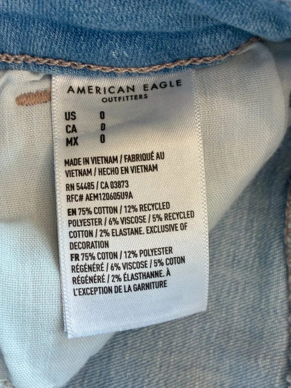American Eagle Curvy High-Rise Shortie Stretch Jean Cross-Front Button Shorts - Picture 11 of 14